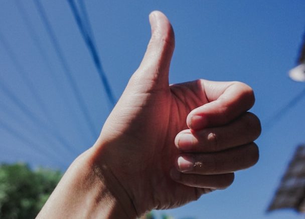 Phot of a person giving a thumbs up sign
