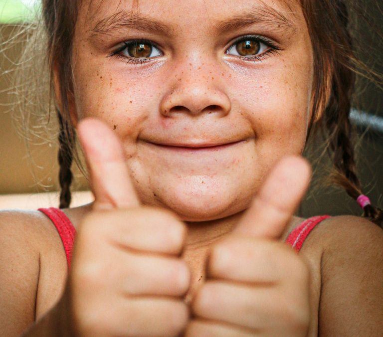 Phot of a person giving a thumbs up sign